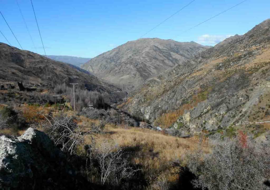 The view down the Roaring Meg Ck, with its valley framing Mt Difficulty in the background.