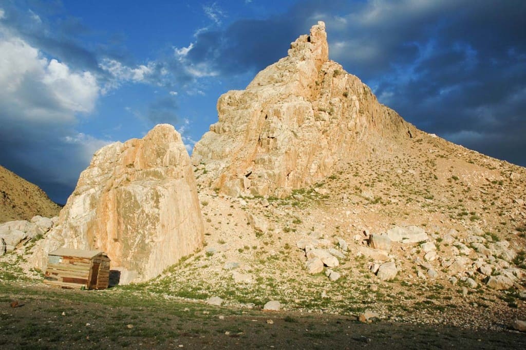An outcrop of limestone in the Gobi Altai, Mongolia - known as the "White Doors". The featured image shows the "White Doors" from the other side. Our Landcruiser gives the scale. We slept in swags between it and the limestone. Two times in the night I heard wolves howling high up in the mountains.