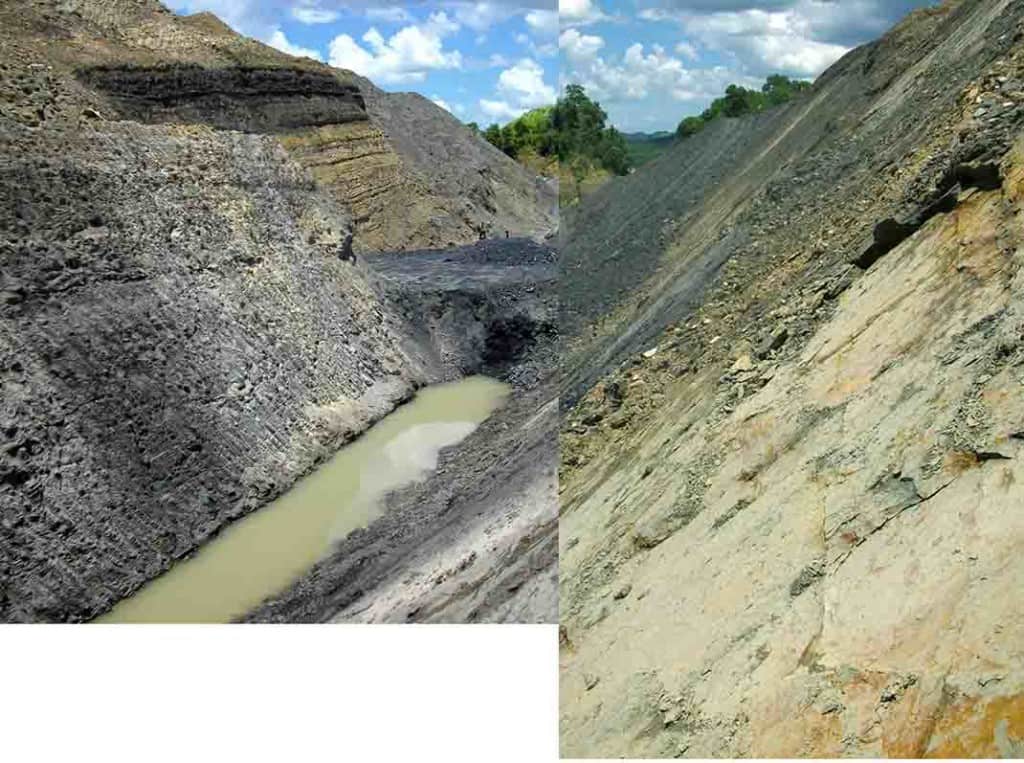 Edging down the low wall of a mine, Kalimantan, Indonesia.