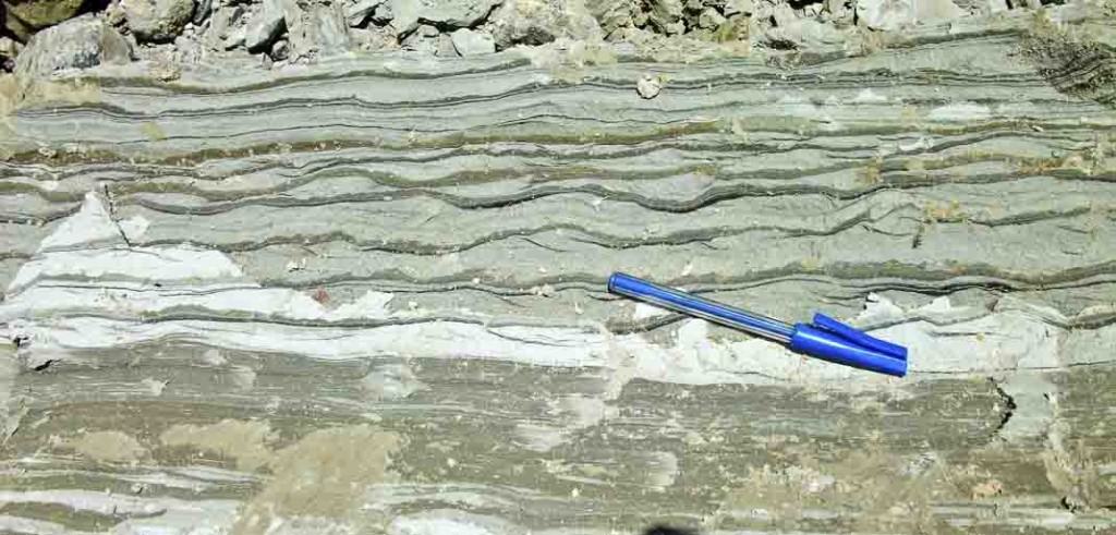Tidal bedding in the high wall of an coal mine. Kalimantan, Indonesia. The lighter beds form as the tide flowed, and the darker layers of mud formed in the still waters of slack-tide