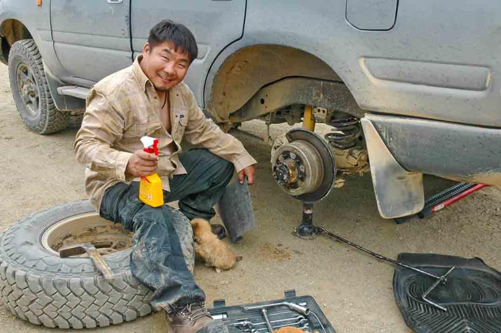 Repairing Landcruiser wheel assembly in Mongolia.