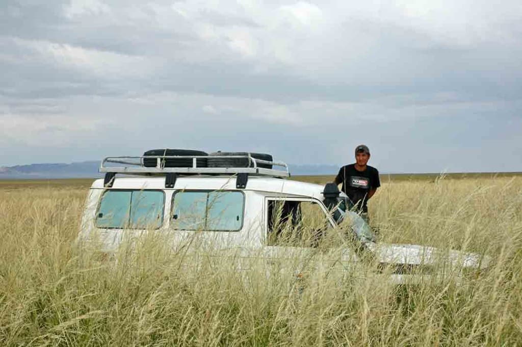 In Mongolia, travel across the wide valleys is often tricky. You can be bogged in a flash, and unlike anywhere else , tall grass can hide the danger.