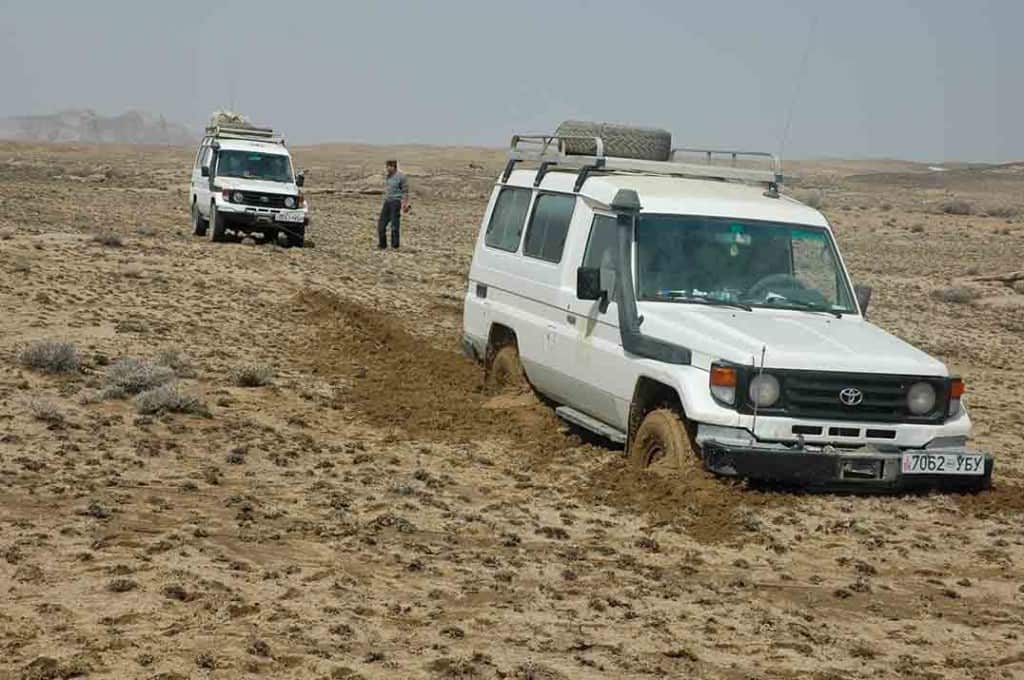 In Mongolia, sometimes your only hope is another vehicle. Bogged to the floorboards, nothing to tie your winch to, screwed without some help.