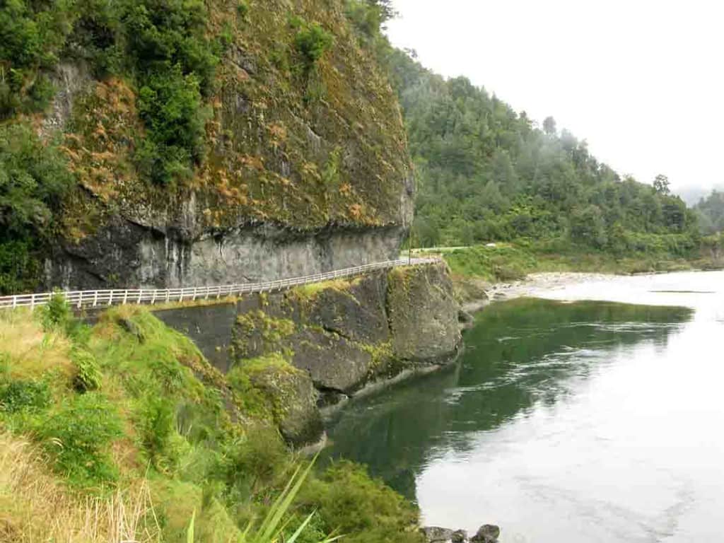 The one-way road clawing its way around Hawks Crag, above the Buller River in New Zealand.