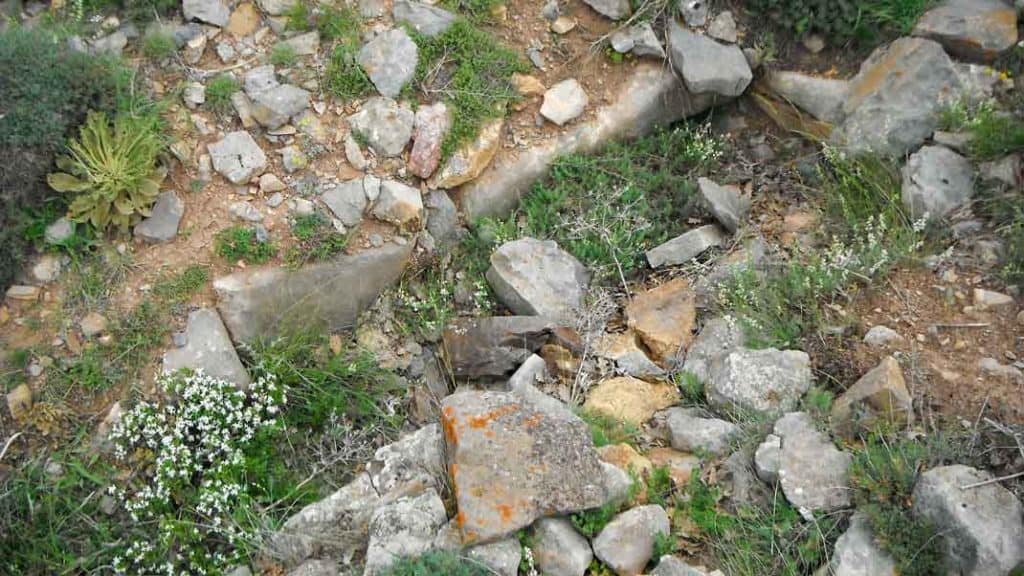 A simple stone-lined grave.