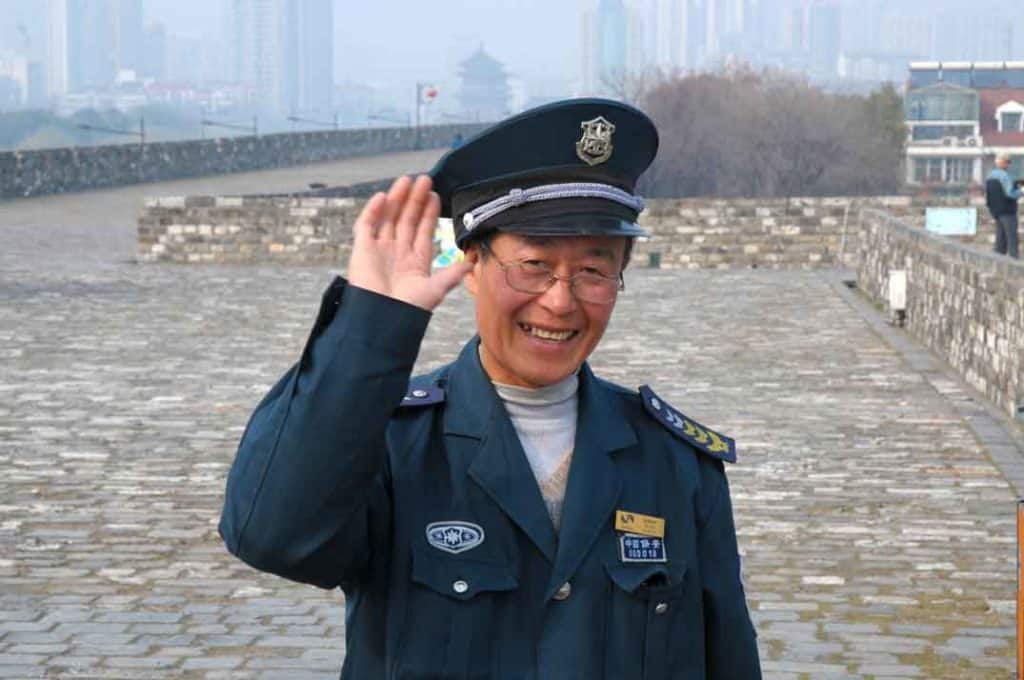 A Nanjing City Wall staff member - keen to show me more good examples of stamped bricks.