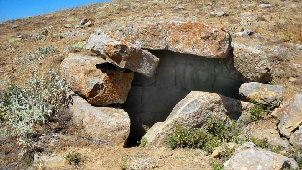One of the vaulted tombs - a built-up end wall can be seen inside, and vandalism shows the vaulted roof.