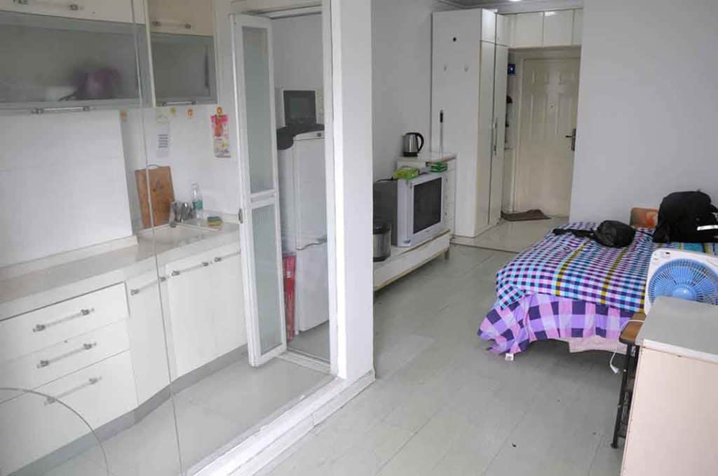 The view across my apartment from the window to the door. The little kitchenette is on the left.