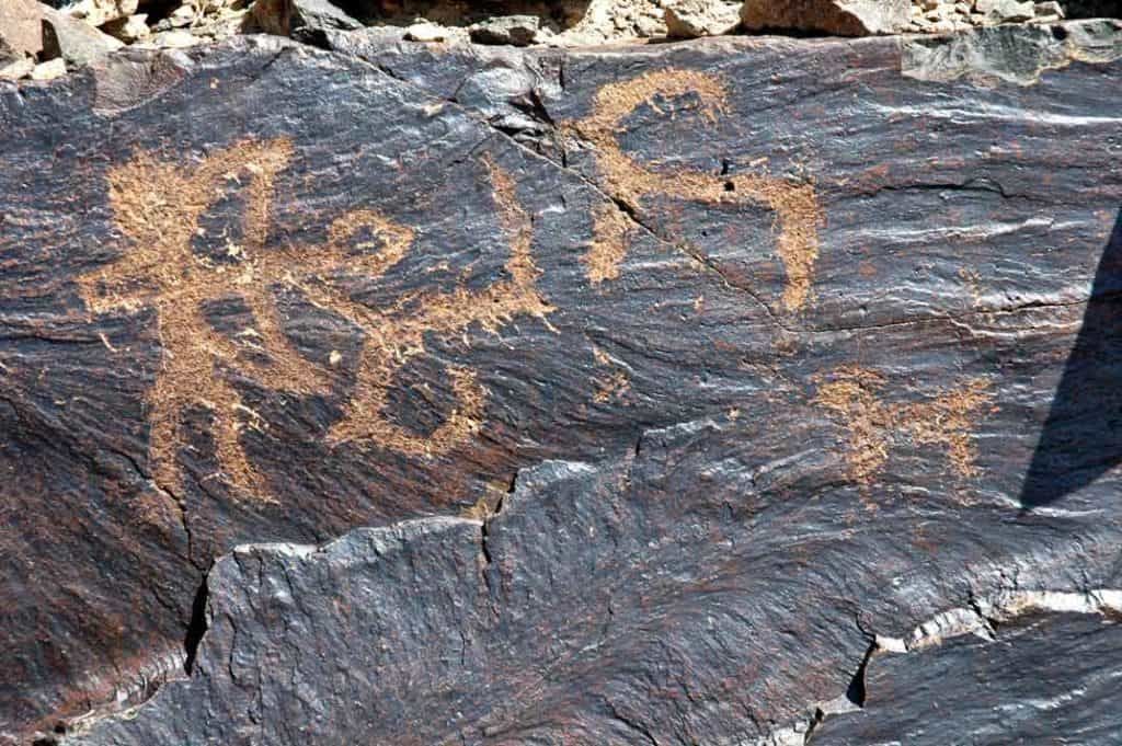 Mongolian petroglyph - hunter and ibex.