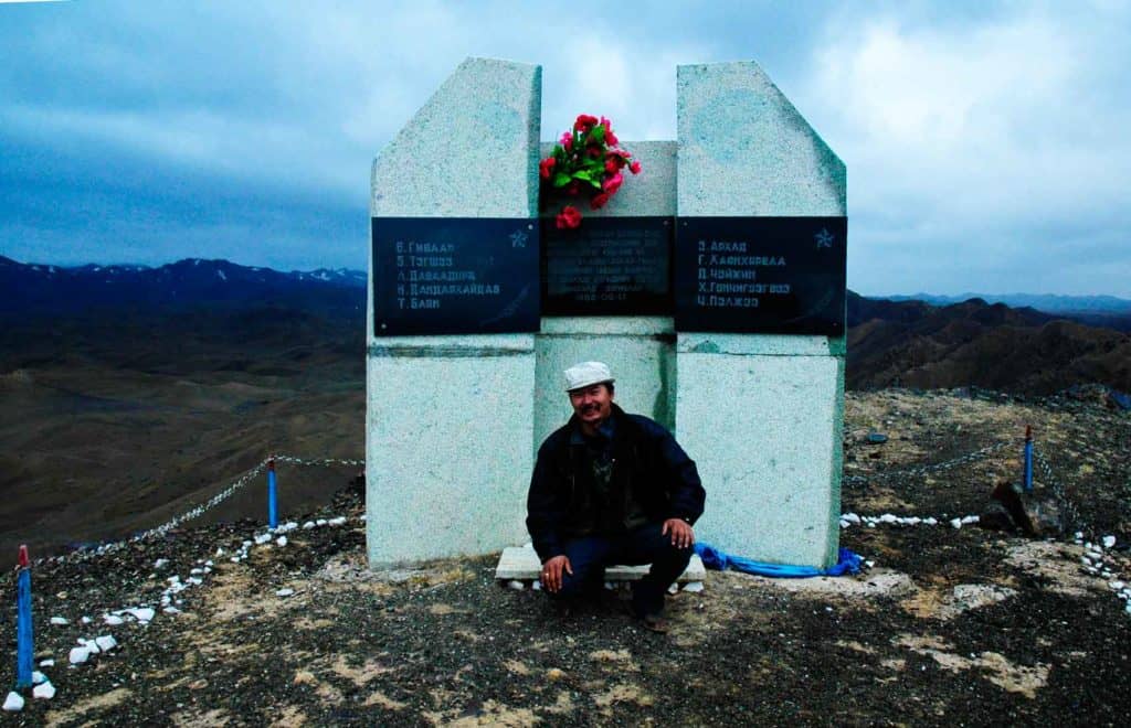 Amar in front of the memorial to ten Mongolian soldiers who fought to the last man here in 1948.