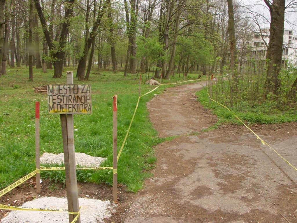Pozor Mine (Attention - Landmines) tape in a Sarajevo park. If you've come from the direction you weren't supposed to, the 'wrong' side only becomes clear when you reach the footpath.