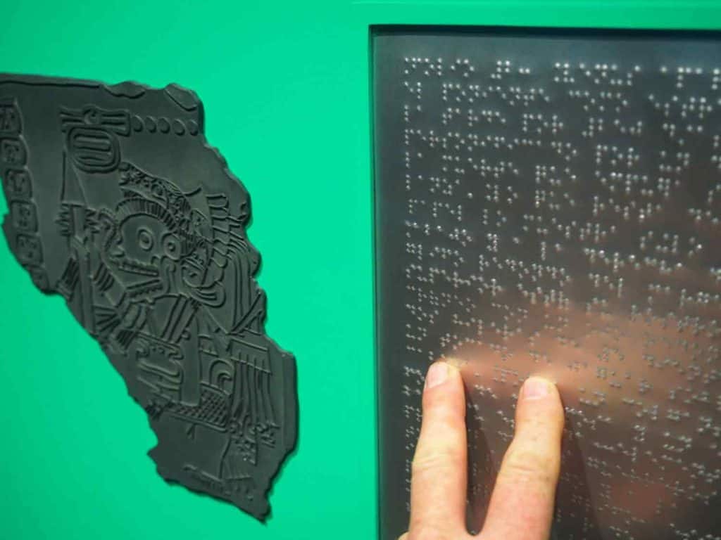 Details of the The Maya Codex of Mexico display for sight-impaired people. Portions of the Codex are presented in relief, and information in Braille. 