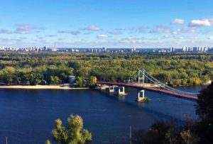 The view across the Parkovy Pedestrian Bridge to Trukhaniv Island in the Dnipro River, Kyiv.